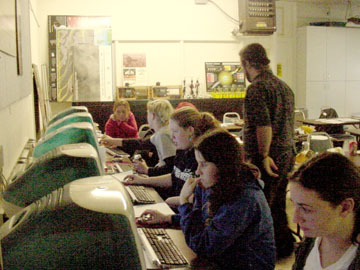 Students working on Apple computers.