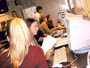 Students working on Apple computers.